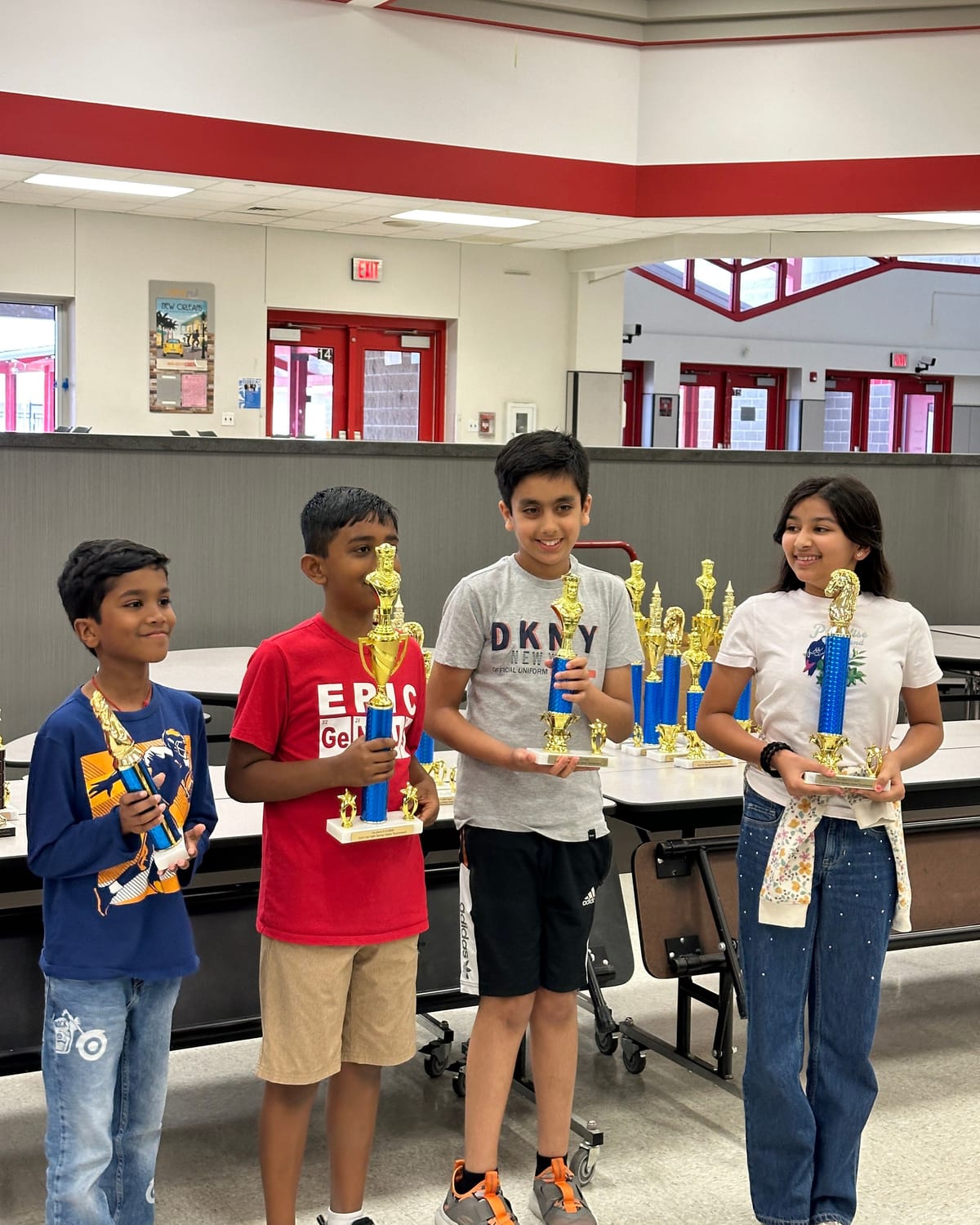 Viti holding her 2nd place trophy alongside other trophy winners