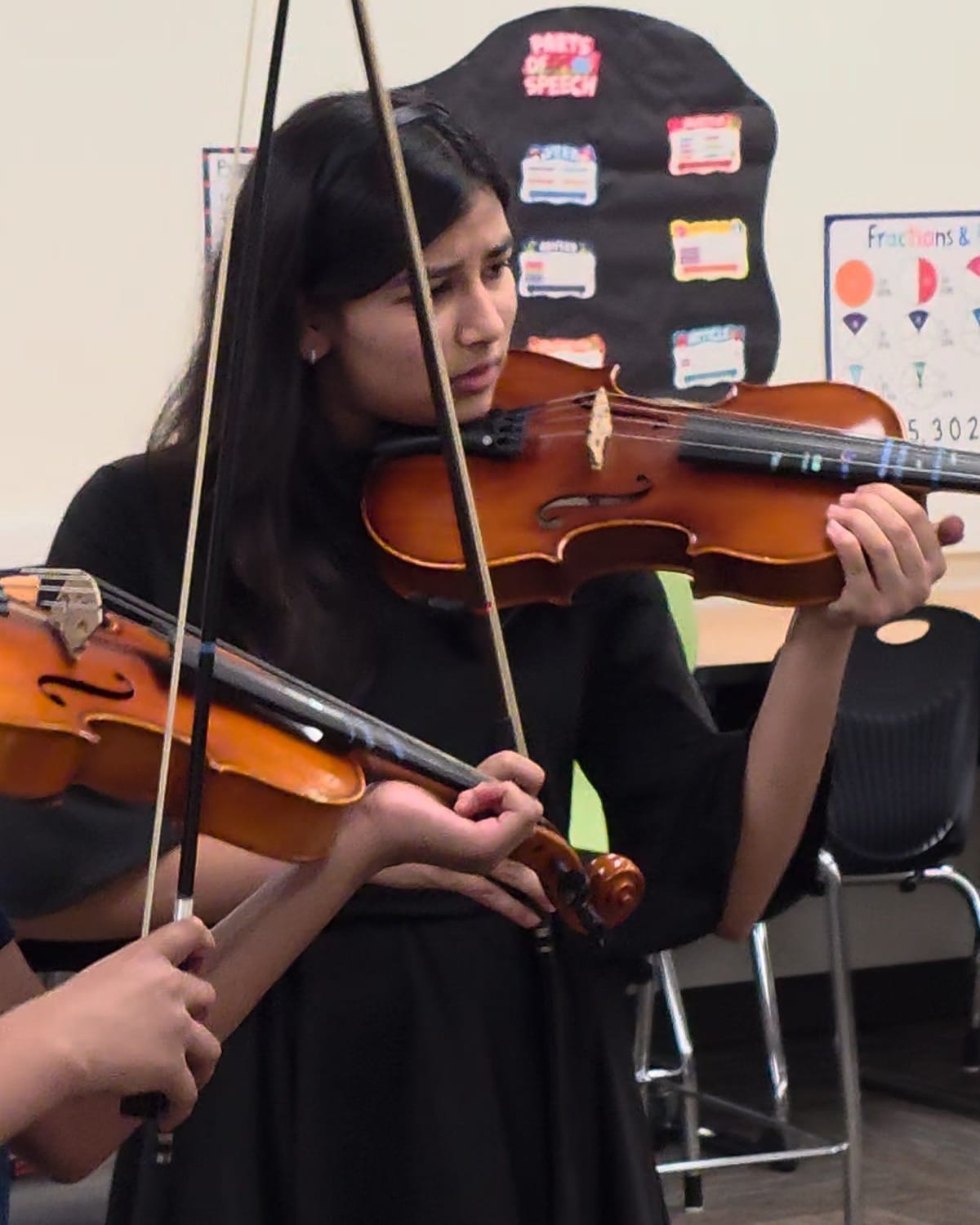 Viti playing viola in an ensemble performance